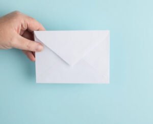 Hand holding envelope